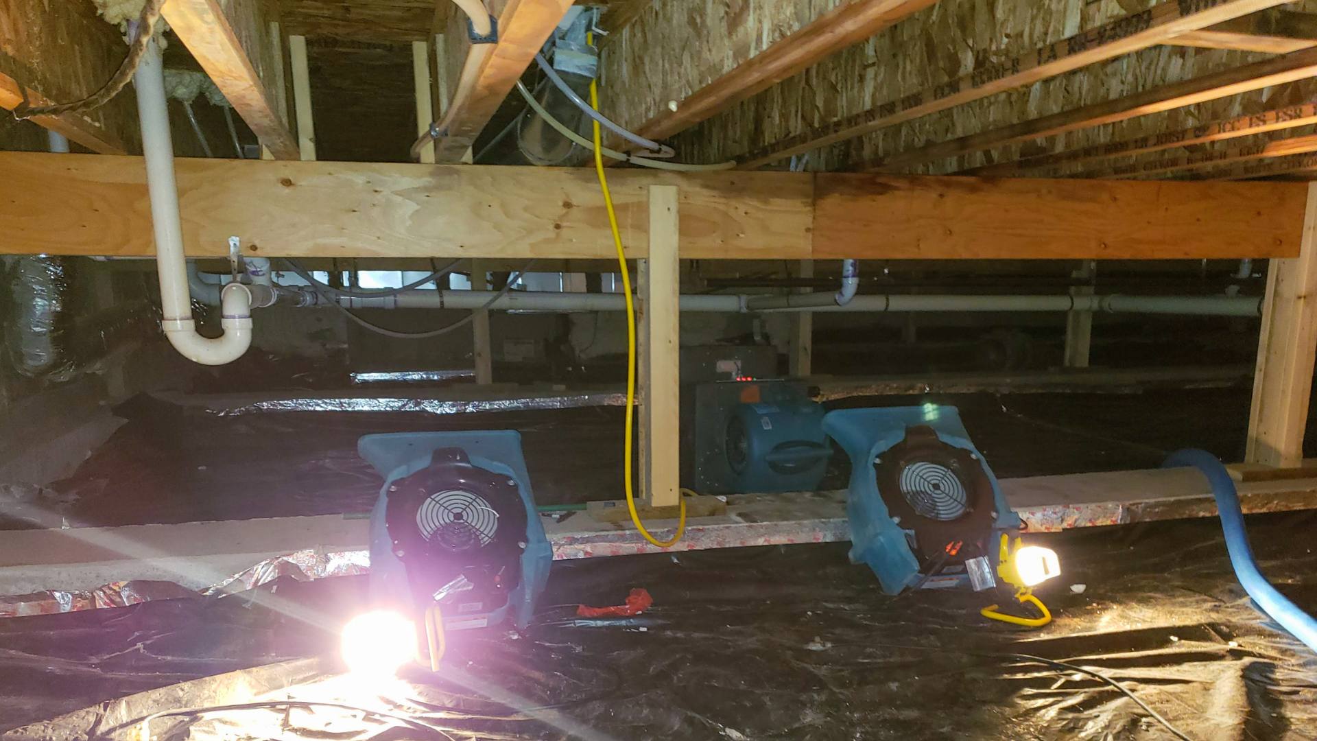 West Vancouver technician checking water damaged drywall with a moisture meter